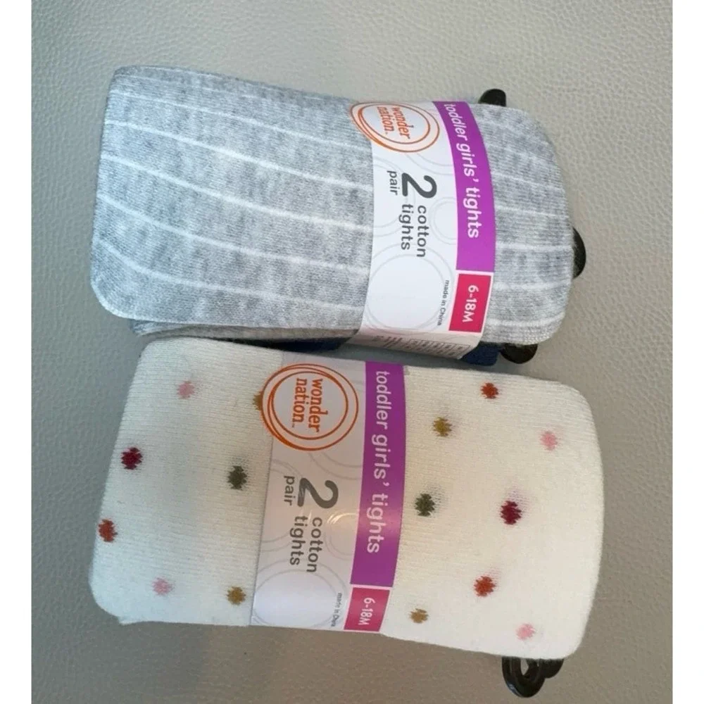 Four pairs of toddler girls cotton tights size 6-18 months.